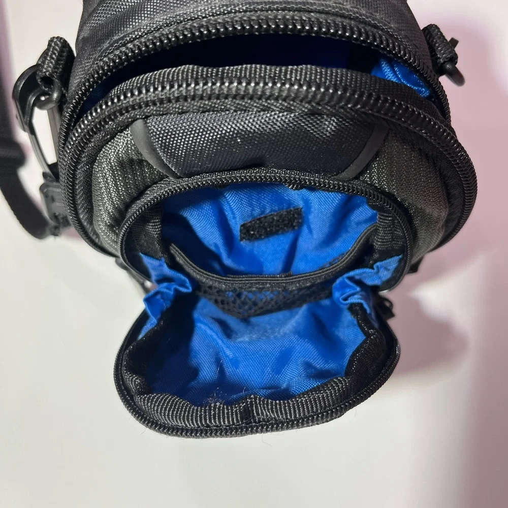 Case Logic Small black/dark green camera case with shoulder strap.